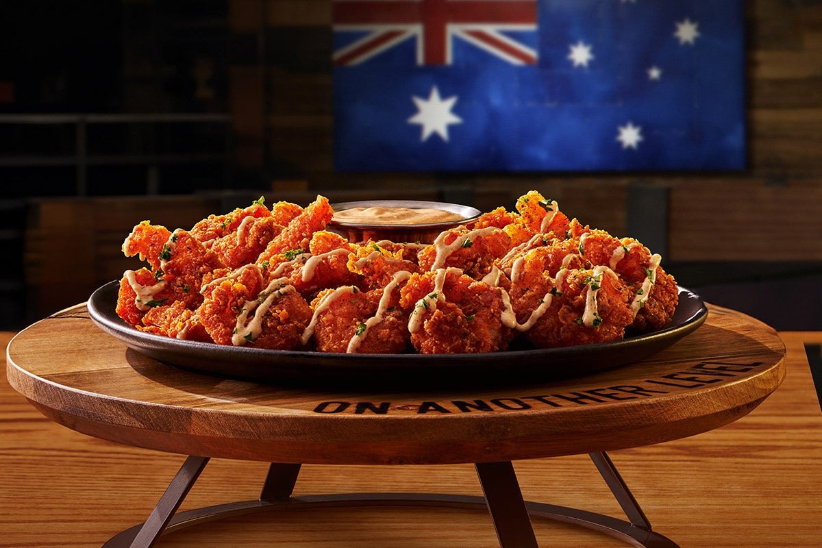 Fresh BLOOMIN' FRIED SHRIMP prepared with coastal flavors and served with our signature sauces