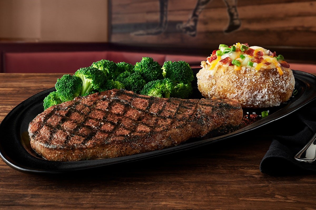 BONE-IN RIBEYE 18 OZ. grilled to perfection with Outback signature seasoning
