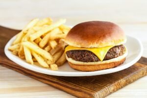 Hearty BOOMERANG CHEESEBURGER served on a toasted bun with fresh toppings and signature sauce