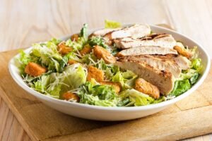 Fresh and crisp BRISBANE CAESAR SALAD with premium ingredients and house-made dressing