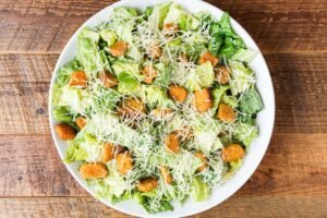 Fresh and crisp BRISBANE CAESAR SALAD PLATTER with premium ingredients and house-made dressing
