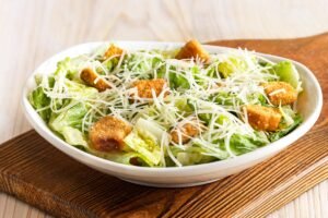 Fresh and crisp CAESAR SIDE SALAD with premium ingredients and house-made dressing