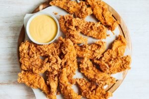 Juicy CHICKEN TENDER PARTY PLATTER seasoned and cooked to golden perfection at Outback Steakhouse