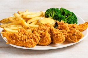 Juicy CHICKEN TENDER PLATTER seasoned and cooked to golden perfection at Outback Steakhouse