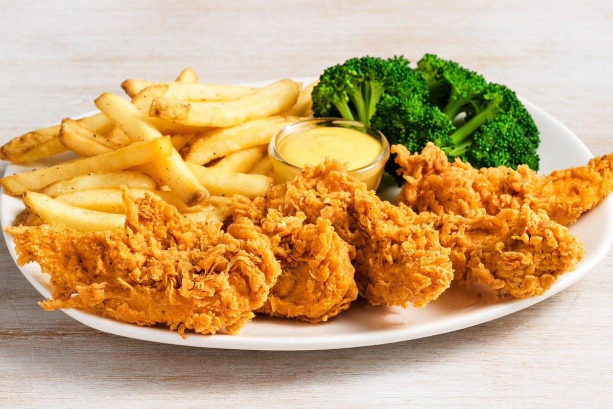 Juicy CHICKEN TENDER PLATTER seasoned and cooked to golden perfection at Outback Steakhouse