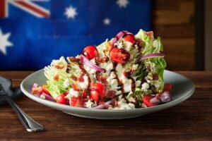 Fresh and crisp CLASSIC BLUE CHEESE WEDGE SIDE SALAD with premium ingredients and house-made dressing