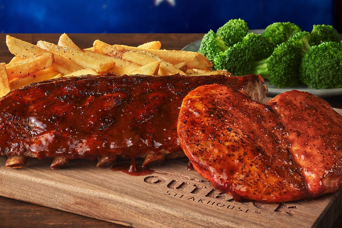 Juicy DROVER'S RIBS & CHICKEN PLATTER seasoned and cooked to golden perfection at Outback Steakhouse