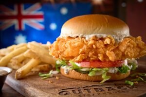 Juicy FRIED BUTTERMILK CHICKEN SAMMIE seasoned and cooked to golden perfection at Outback Steakhouse