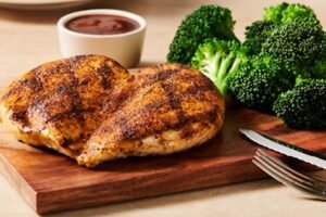Juicy GRILLED CHICKEN ON THE BARBIE seasoned and cooked to golden perfection at Outback Steakhouse