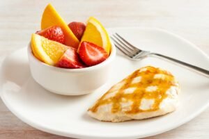 Juicy GRILLED CHICKEN ON THE BARBIE (5 OZ) seasoned and cooked to golden perfection at Outback Steakhouse