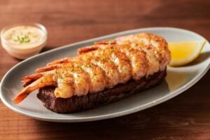 Fresh GRILLED SHRIMP ON THE BARBIE prepared with coastal flavors and served with our signature sauces