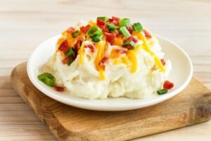 Mouthwatering LOADED MASHED POTATOES prepared with premium ingredients and signature spices