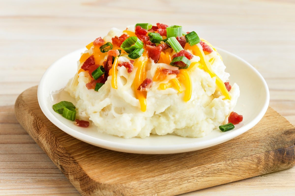 Mouthwatering LOADED MASHED POTATOES prepared with premium ingredients and signature spices
