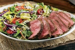 STEAKHOUSE SALAD grilled to perfection with Outback signature seasoning